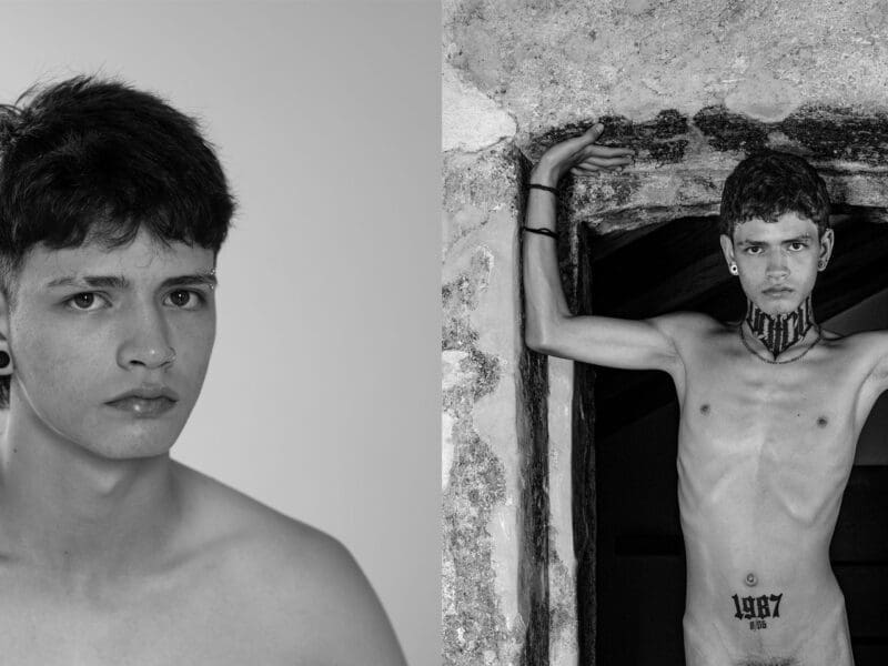 Portrait of a young man in natural light, capturing a fleeting moment of vulnerability and quiet self-awareness.